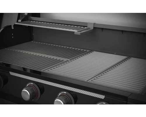 Innenansicht eines Gasgrills mit Grillrosten und Warmhalterost.