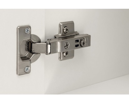 Möbelscharnier am Möbelstück befestigt