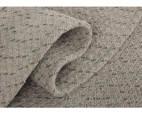 Nahaufnahme eines hellen Teppichs mit gewebter Textur