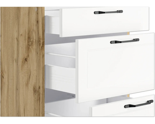 Schrank mit weißen Schubladen und schwarzen Griffen