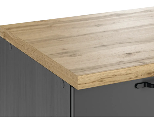 Detailaufnahme einer Kommode mit einer Arbeitsplatte in Holzoptik