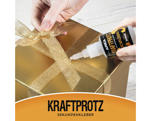 Auftragen von Sekundenkleber auf ein Geschenk mit Schleife