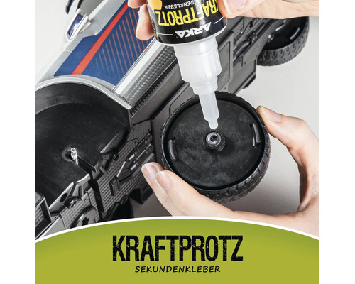 Auftragen von Sekundenkleber auf ein Spielzeugrad