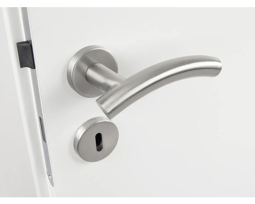 Edelstahl Türdrücker mit Schloss auf weißer Tür