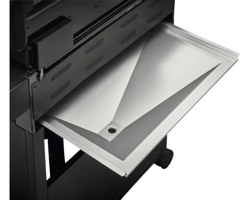 Detailansicht einer Fettauffangschale in einem Grill