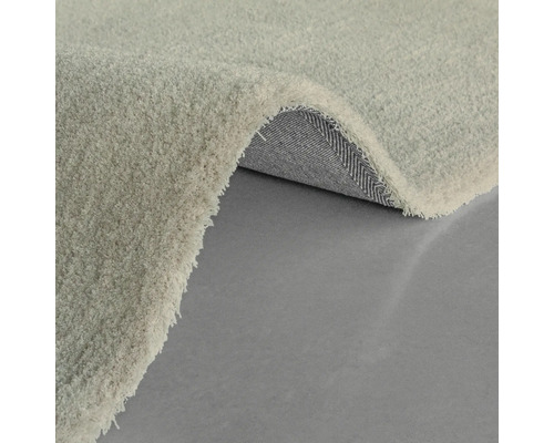 Detailansicht eines hellen Teppichs mit Flor