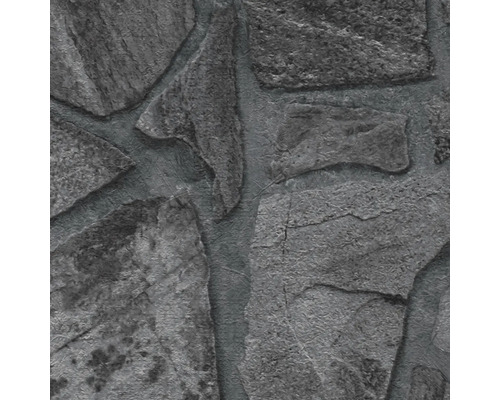 Nahaufnahme einer grauen Steinwandstruktur.