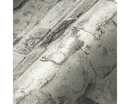 Nahaufnahme einer Rollentapete mit Steinoptik.