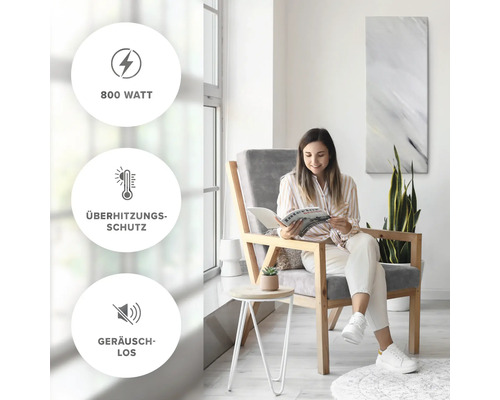 Frau liest in einem hellen Raum. Produktmerkmale: 800 Watt, Überhitzungsschutz, Geräuschlos