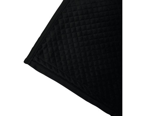 Detail einer gesteppten, dunklen Decke mit quadratischem Muster