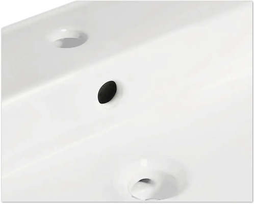 Detailansicht eines Waschbeckens mit Überlauf