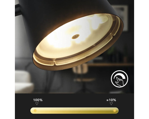Nahaufnahme einer schwarzen Lampe mit Dimmfunktion und Helligkeitsregler