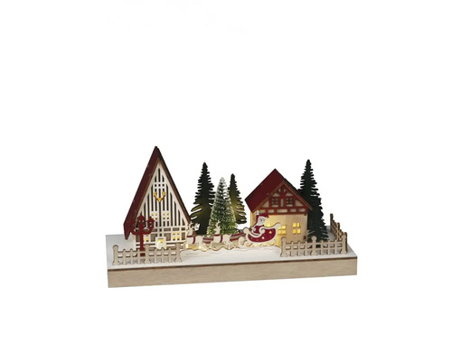 Dekorative Weihnachtsszene mit Häusern, Bäumen und Weihnachtsmann im Schlitten.