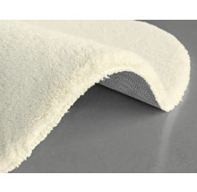 Detailansicht eines beigefarbenen Teppichs mit Textur