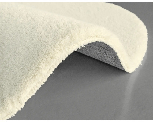 Detailansicht eines beigefarbenen Teppichs mit Textur
