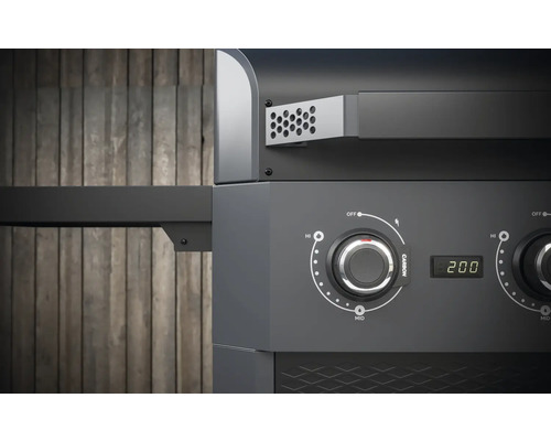 Detailansicht eines Holzkohlegrills mit Temperaturregler und digitaler Anzeige