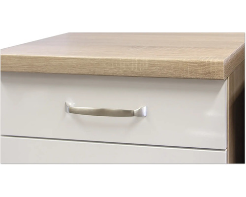 Detailaufnahme eines Möbels mit Schubladen und einem Griff