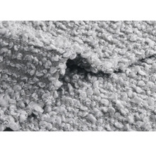 Nahaufnahme eines grauen Teppichs mit Schlingenstruktur