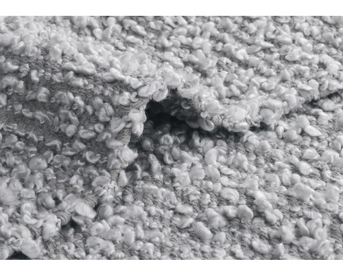 Nahaufnahme eines grauen Teppichs mit Schlingenstruktur