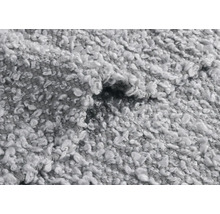 Detailansicht eines grauen Teppichs mit Schlingenstruktur