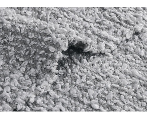 Detailansicht eines grauen Teppichs mit Schlingenstruktur