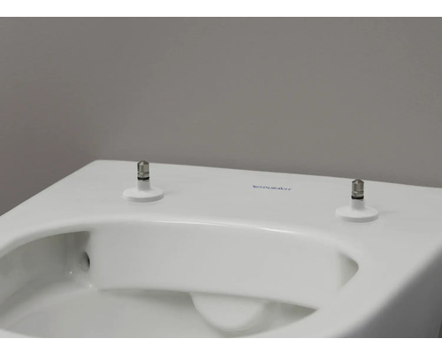 Detailansicht einer weissen Duravit Toilette mit Befestigung
