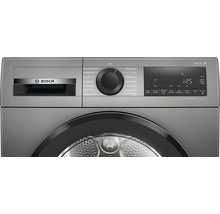 Bosch Logo auf einem Wäschetrockner der Serie 6 mit Drehknopf zur Programmauswahl und digitaler Anzeige