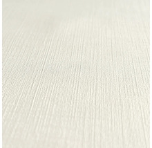 Nahaufnahme einer hellen, strukturierten Tapete.