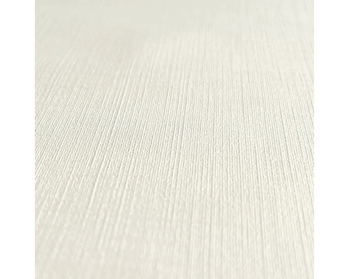 Nahaufnahme einer hellen, strukturierten Tapete.