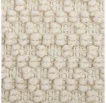 Nahaufnahme eines beigen Teppichs mit Noppenstruktur