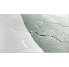 Nahaufnahme einer gestrichenen Wand mit Reliefmuster