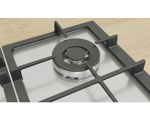 Gaskochfeld mit schwarzem Brenner und silberfarbener Oberfläche