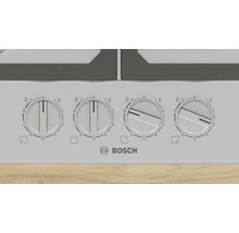 Detailansicht eines Kochfelds mit vier Drehreglern und dem Bosch Logo