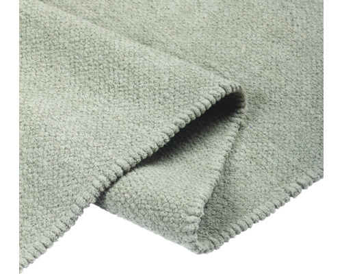 Detailansicht eines grauen Teppichs mit Textur