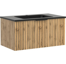 Waschtischunterschrank mit schwarzem Waschbecken, Front in Eichenoptik mit Lamellen-Design.