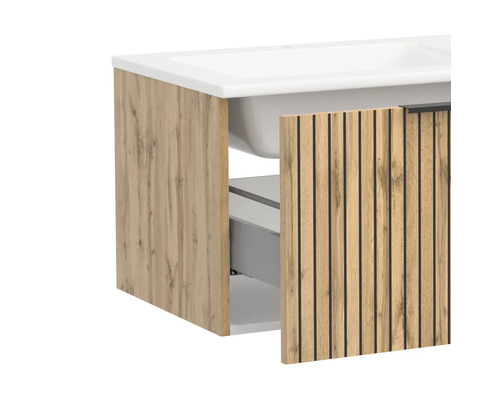 Badunterschrank mit Waschbecken in Holzoptik mit schwarzen Lamellen und einer geöffneten Schublade.