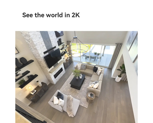 Ansicht eines Wohnzimmers mit modularem Sofa, Kaffeetisch und Fernseher