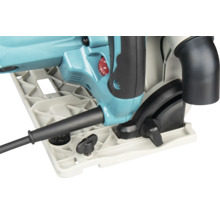 Detailansicht einer türkisfarbenen Tauchsäge mit Grundplatte, schwarzen Einstellknöpfen, rotem Drehzahleinstellrad und Absaugstutzen.