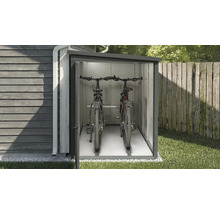 Fahrradbox mit zwei Fahrrädern im Garten.