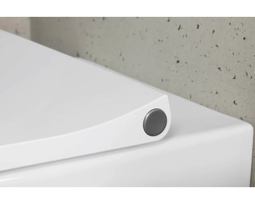 Weißer WC-Sitz mit Absenkautomatik und Knopf