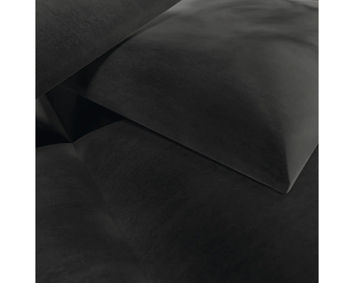 Nahaufnahme von dunklem Polsterstoff auf einem Kissen oder Sofa.