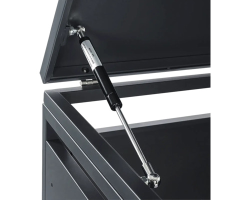 Gasdruckfeder an einer Metallbox zur Unterstützung beim Öffnen des Deckels.