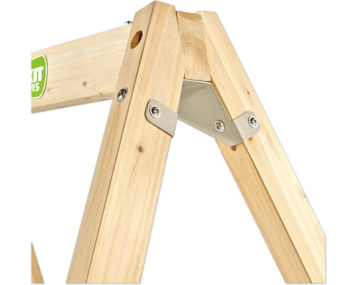 Detailansicht einer Eckverbindung für ein Schaukelgestell aus Holz mit grauer Metallhalterung, Bolzen und dem EXIT TOYS Logo.