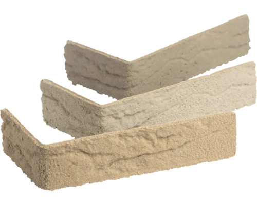 Beige Verblendsteine Eckstücke in L-Form mit strukturierter Natursteinoptik.