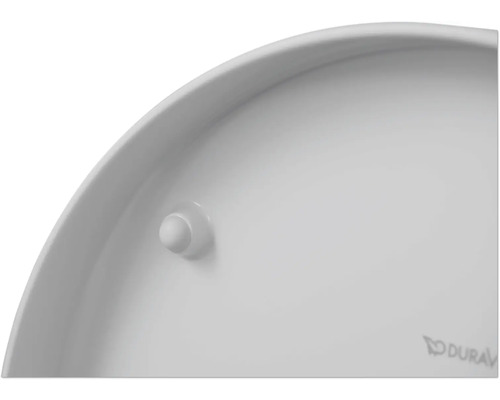 Detailansicht der Unterseite eines weißen WC-Sitzes mit einem Puffer und dem Duravit Logo.