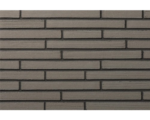 Verblendsteine aus Beton in Riemchenoptik, langformatig mit strukturierter Oberfläche.