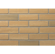 Klinkerriemchen in beige-gelber Steinoptik mit grauen Fugen für die Wandgestaltung.