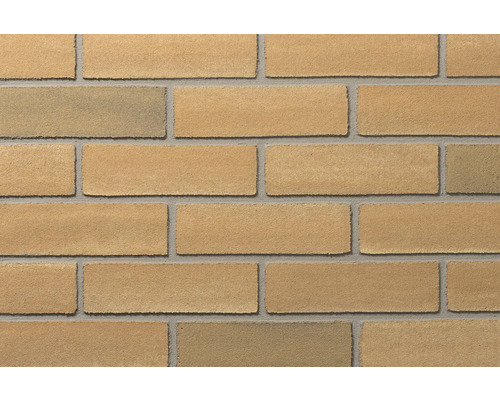 Klinkerriemchen in beige-gelber Steinoptik mit grauen Fugen für die Wandgestaltung.