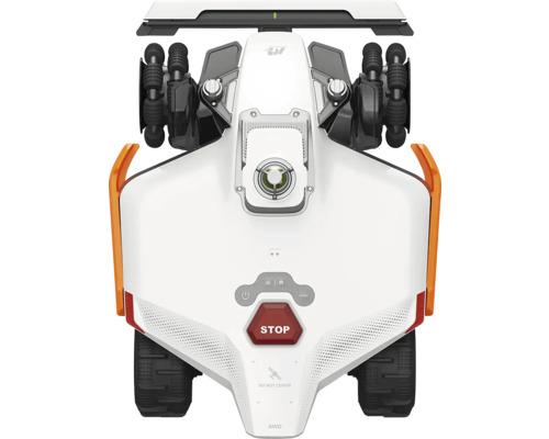 Draufsicht auf einen weißen Mähroboter mit Allradantrieb, schwarzen Profilreifen und einem roten Stop-Knopf.