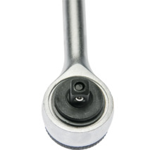 Detailaufnahme eines Knarrenkopfs mit schwarzem Vierkantantrieb und silbernem Metallgehäuse.